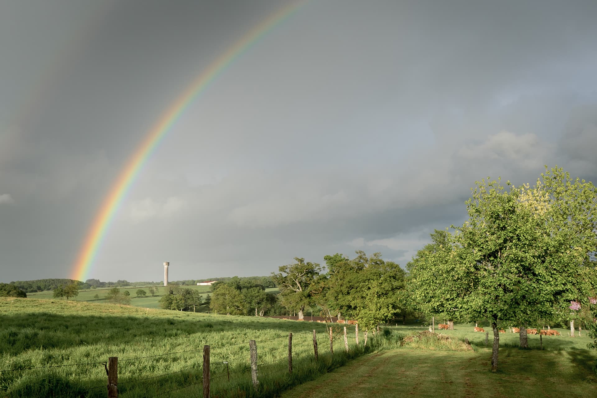 La Terrade at sunset — stone farmhouse, heated pool, and golden Limousin sky